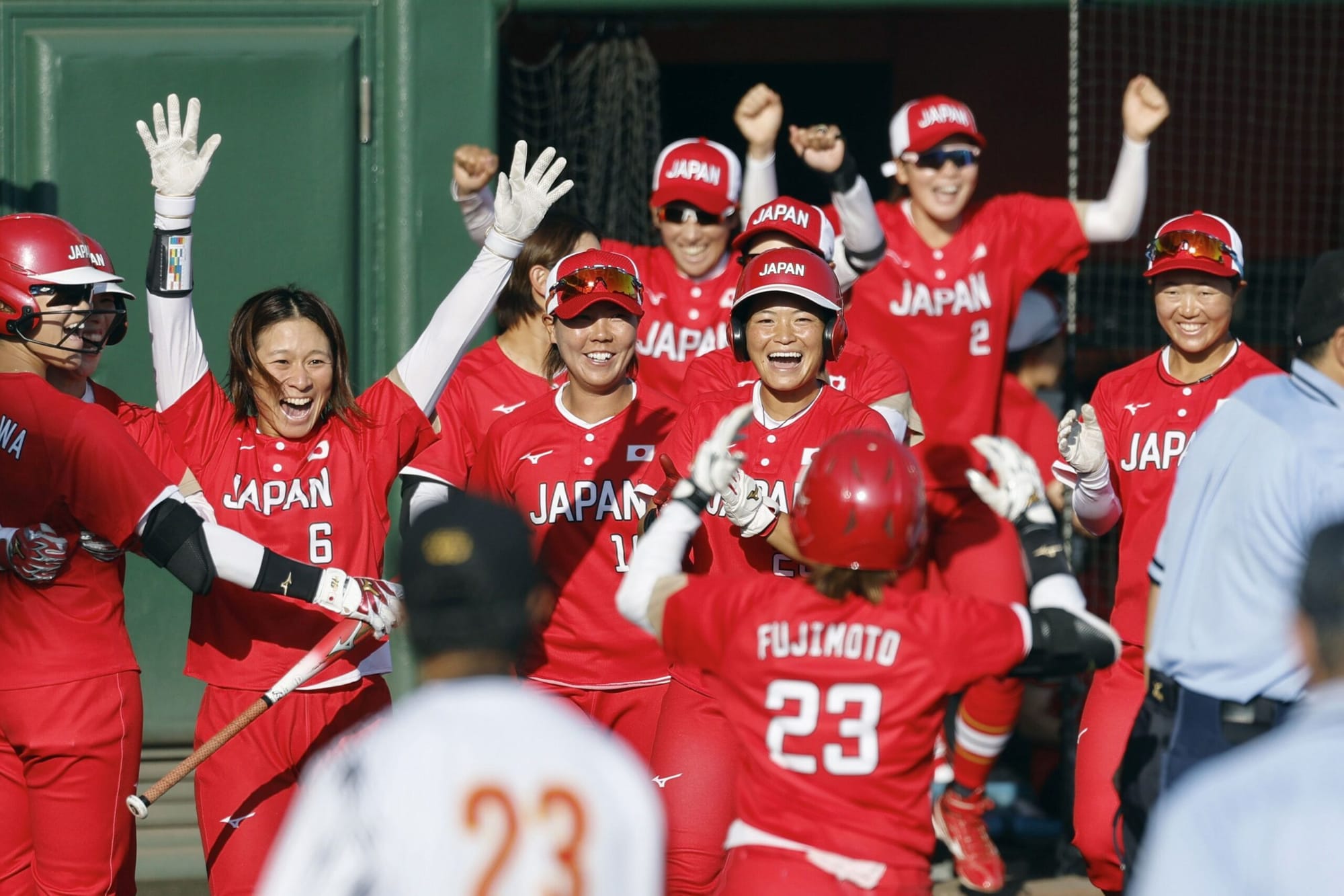 Japan's players celebrate after winning Asian Games softball gold