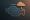 An engine icon with a cloud and droplet, symbolizing poor fuel or toxic input affecting performance.