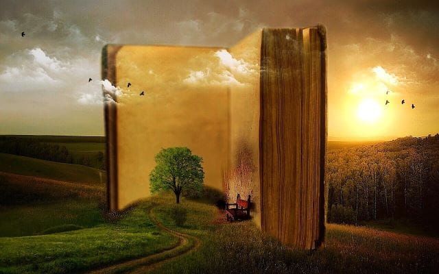 Image of a book with old surreal fantasy pages