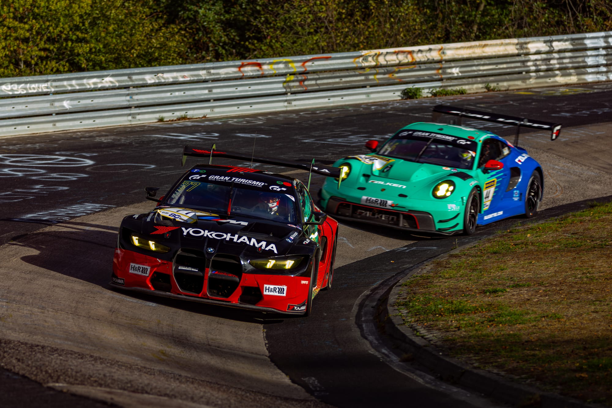 Schubert Motorsport BMW M4 GT3 EVO and Falken Motorsports Porsche 911 GT3 R at the Nürburgring. Adapt to the selected image.