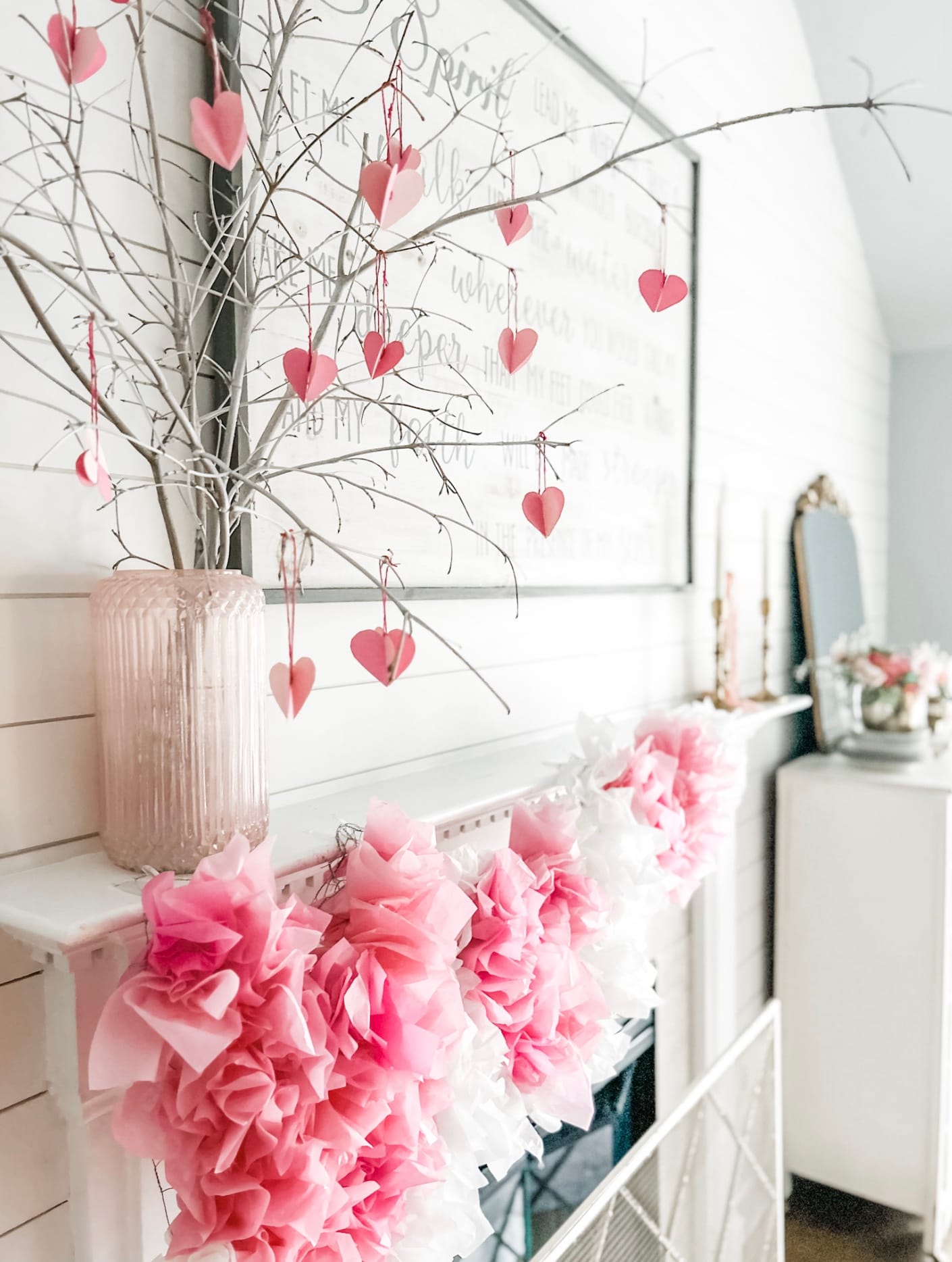 Heart tree and homemade Valentine's Day garland on the mantle in a rustic modern farmhouse