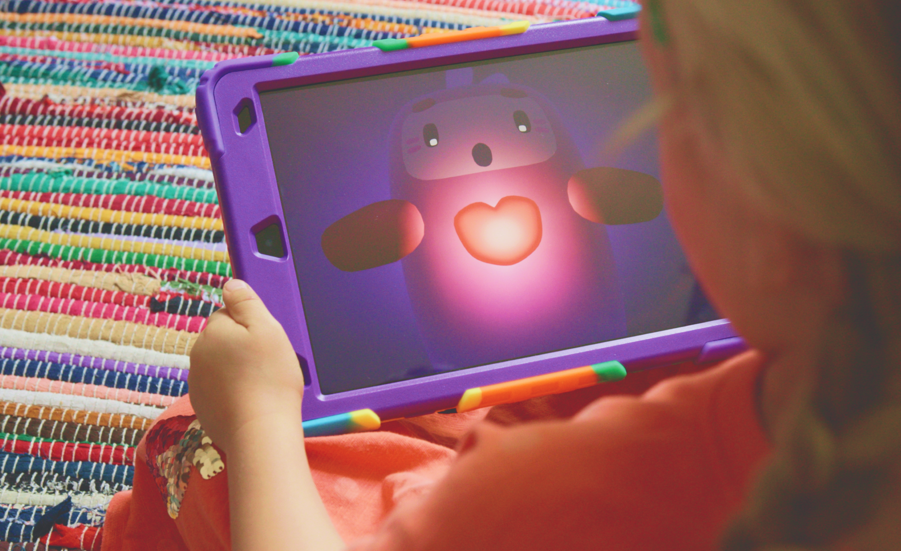 Child learning to regulate emotions with Nurture’s interactive mindful breathing game.