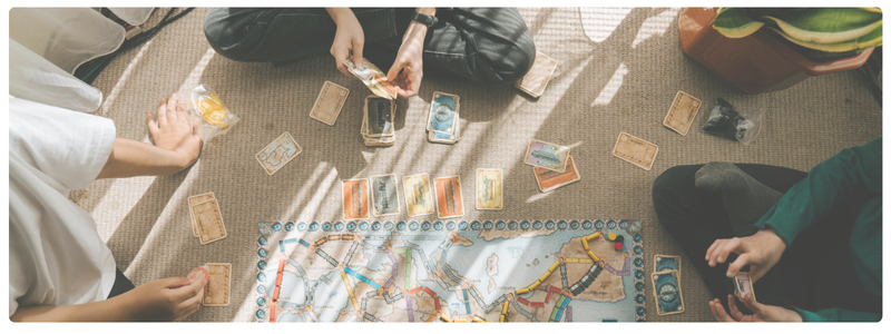 Family playing a board game to balance screen use
