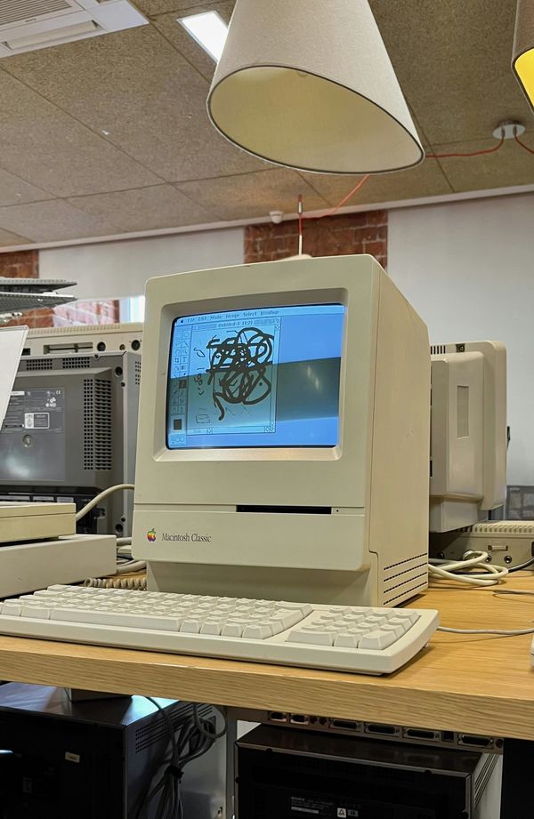 A Mac Classic with scribbling in MacPaint
