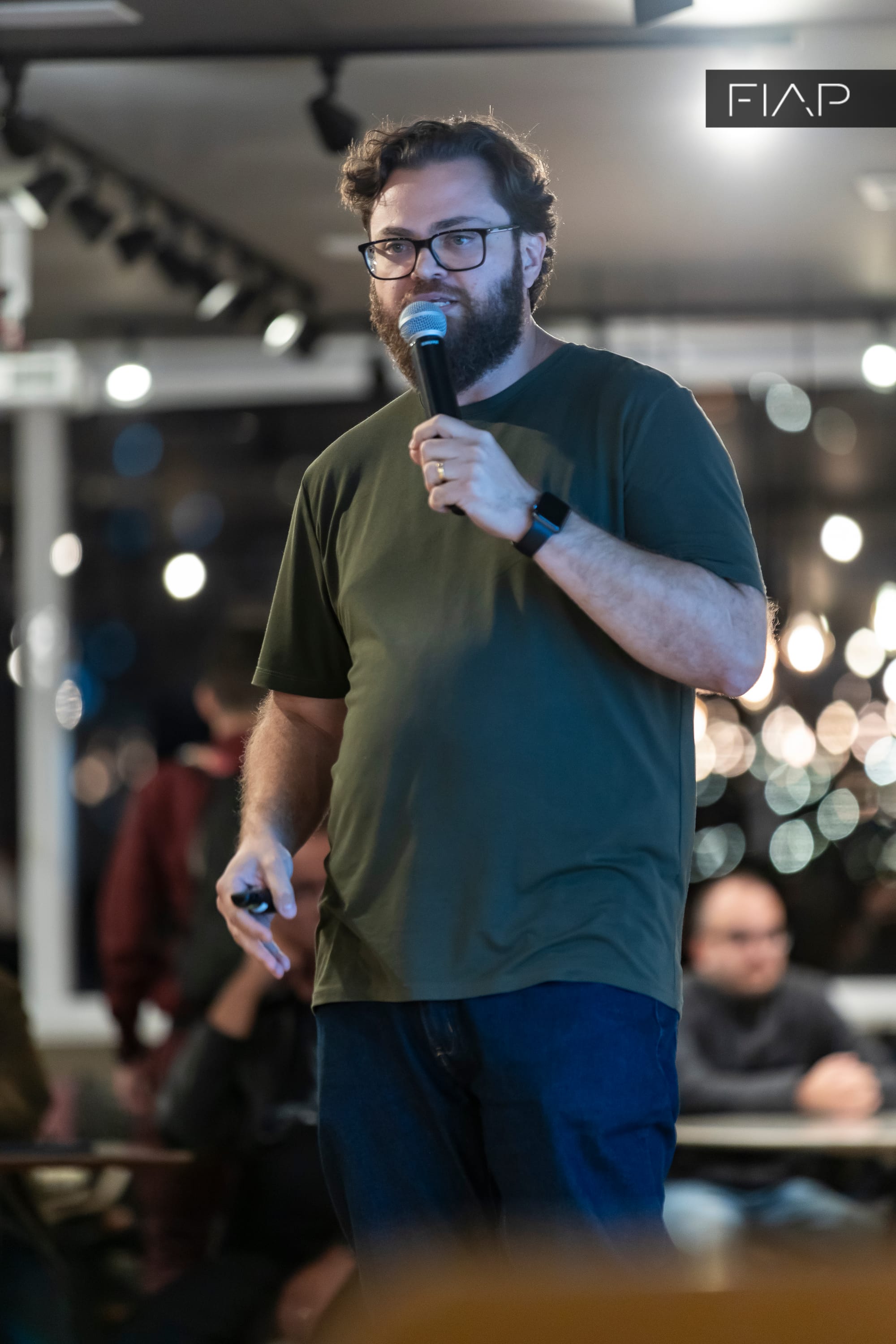 Vitão Fernandes speaking during a technology event.