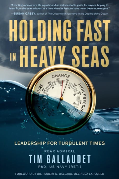 Front cover of Holding Fast in Heavy Seas: a ship's barometer half submerged in dark water beneath a storm sky.