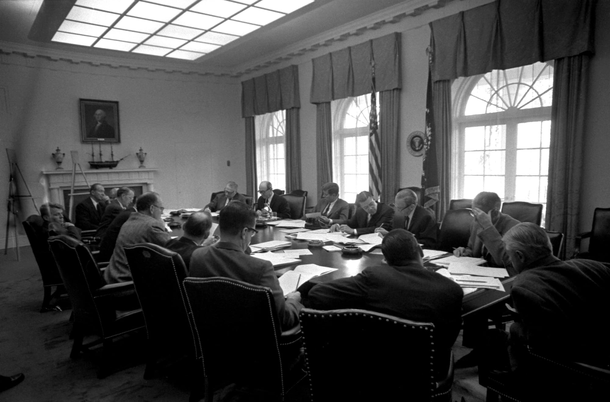 President Kennedy seated with the Executive Committee of the National Security Council around the Cabinet Room table.