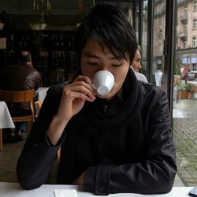 Me having a cup of espresso at a cafe in Heidelberg, Germany