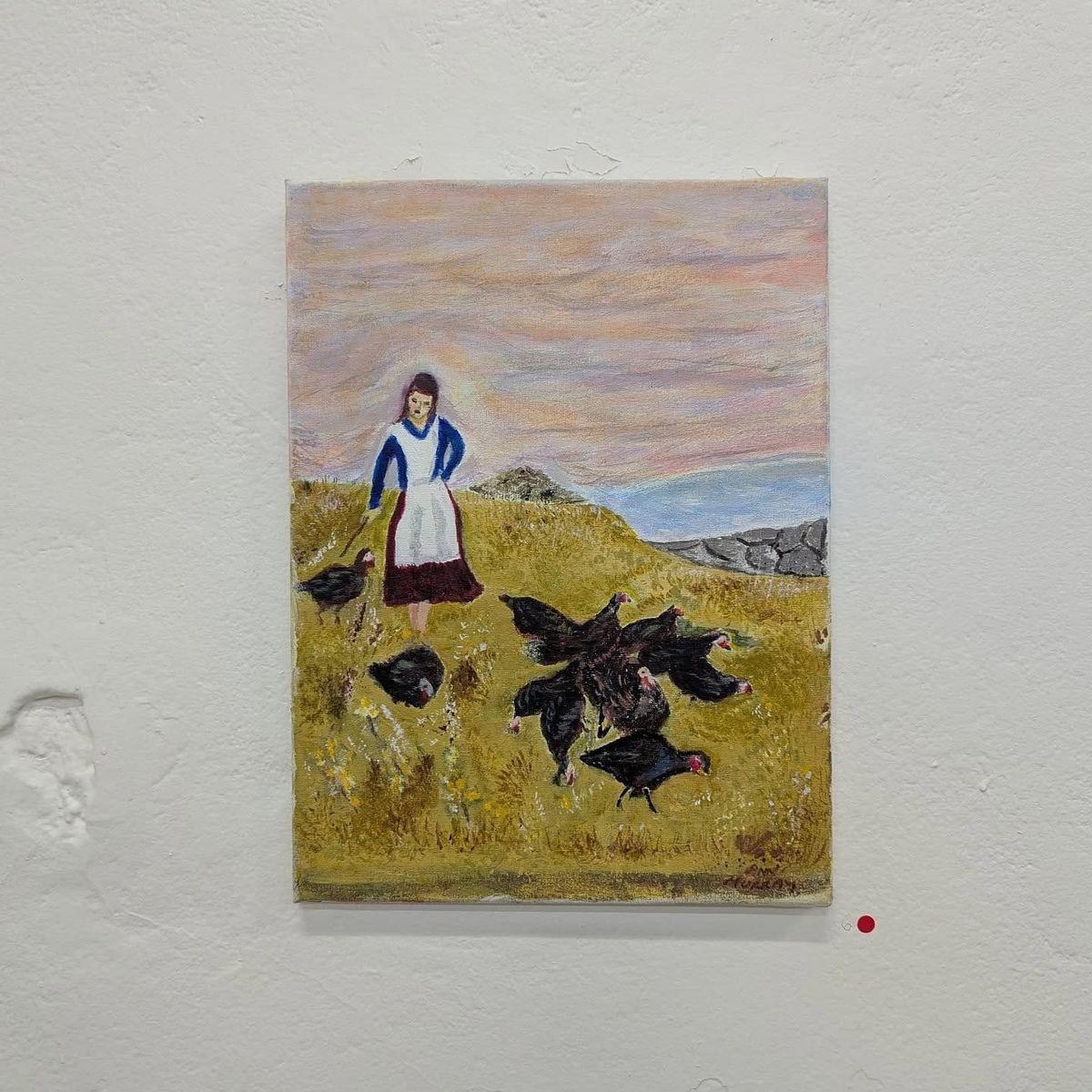 Image of a canvas on a painted white concrete wall. The canvas features a female figure in a field, herding a flock of large black birds