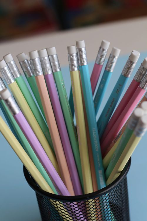 A pot of different coloured pencils.