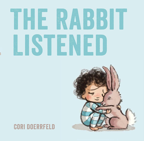A book cover where a little boy is cuddling a rabbit.