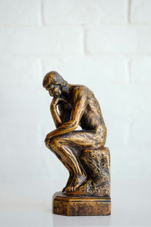 Rodin's Thinking Man pose sculpture