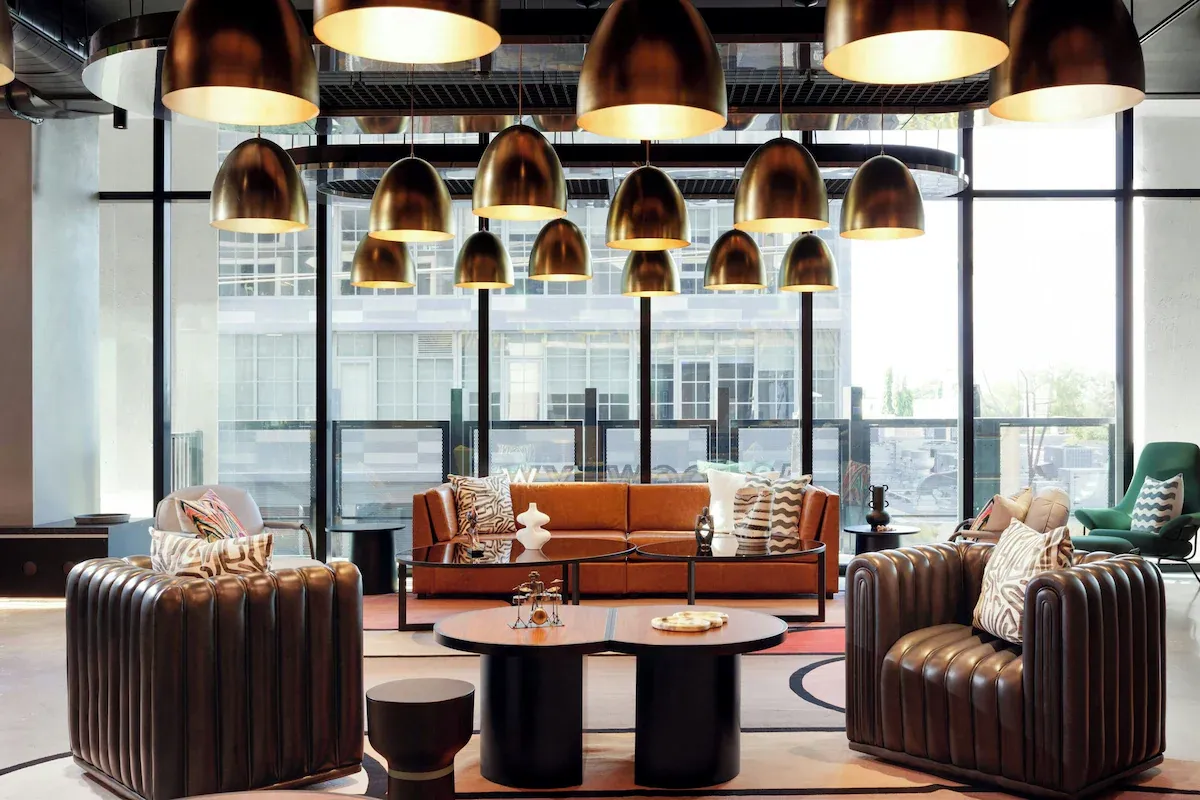 Trendy lobby of Moxy Miami Wynwood hotel with vibrant design and social spaces for New Year’s Eve travelers.