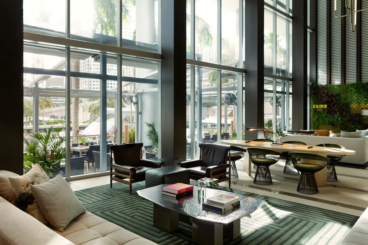 Elegant lobby of Kimpton EPIC Hotel in Downtown Miami with modern design, a popular New Year’s Eve hotel choice.