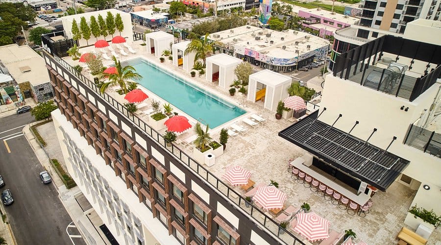 Aerial view of Arlo Wynwood hotel in Miami’s arts district with rooftop pool and modern design, popular stay for Ultra Miami 2026