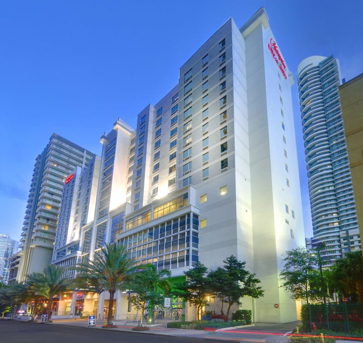 Facade of Hampton Inn & Suites Miami Brickell with modern exterior, budget-friendly hotel near Bayfront Park for Ultra Miami 2026