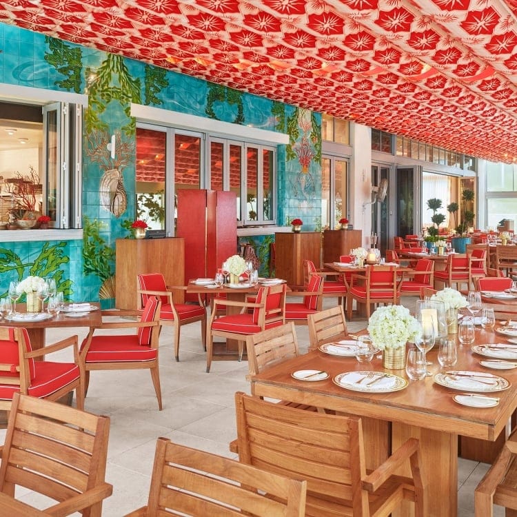 Veranda restaurant at Faena Hotel Miami Beach with oceanfront views and vibrant décor, offering upscale breakfast and lunch at the best luxury hotel in Miami Beach