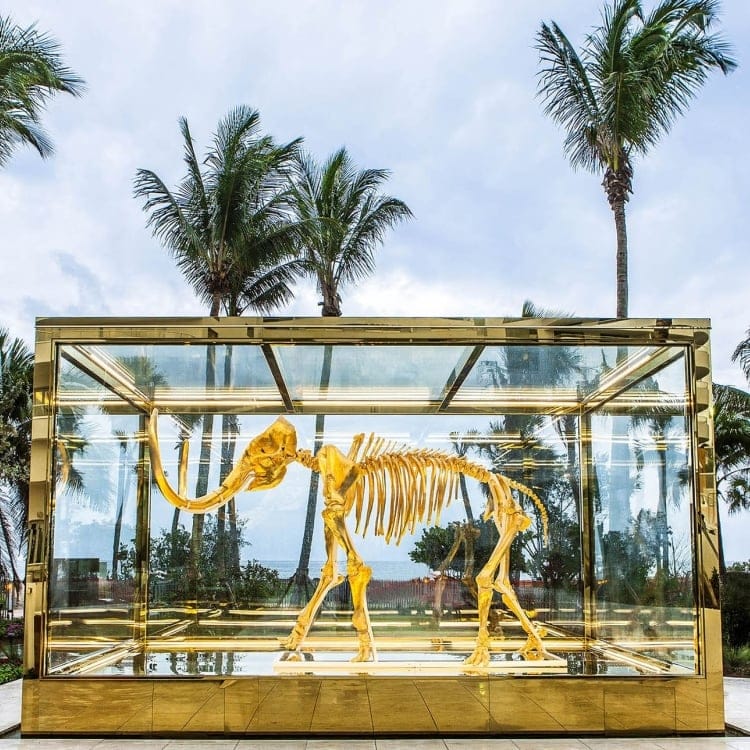 Golden woolly mammoth sculpture by Damien Hirst at Faena Hotel Miami Beach, a signature art piece at the best luxury hotel in Miami Beach.