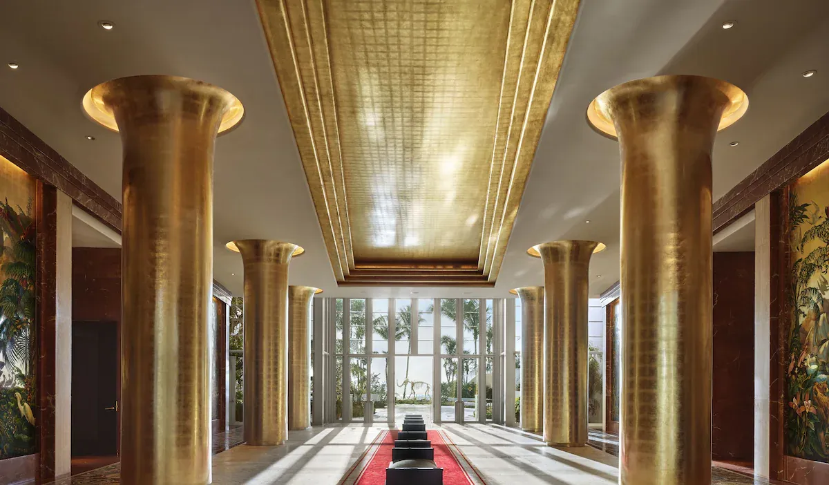 Golden pillars in the Cathedral lobby of Faena Hotel Miami Beach, showcasing luxury Art Deco design at the best hotel in Miami Beach.