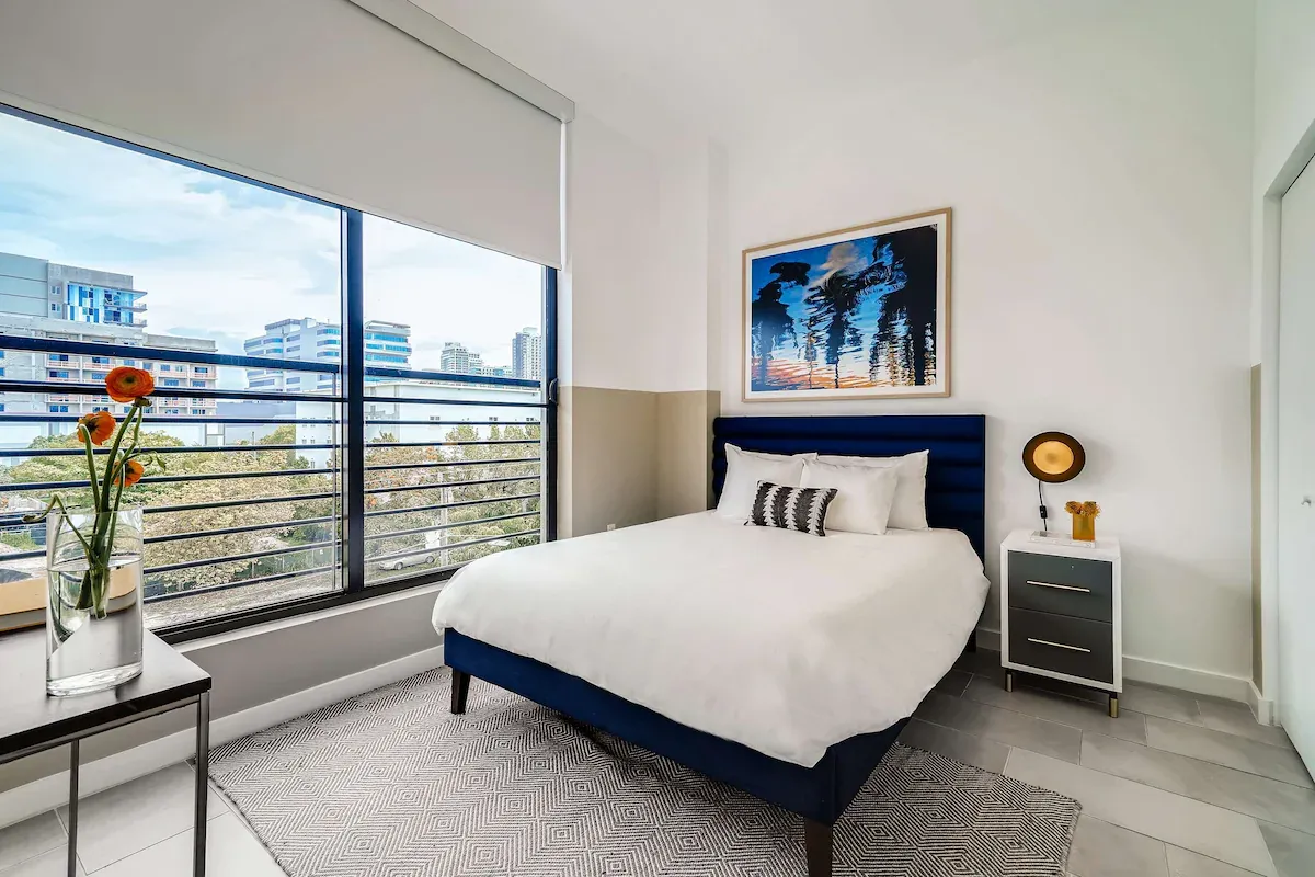 Family-friendly bedroom at Sentral Wynwood featuring plush bedding and ample storage