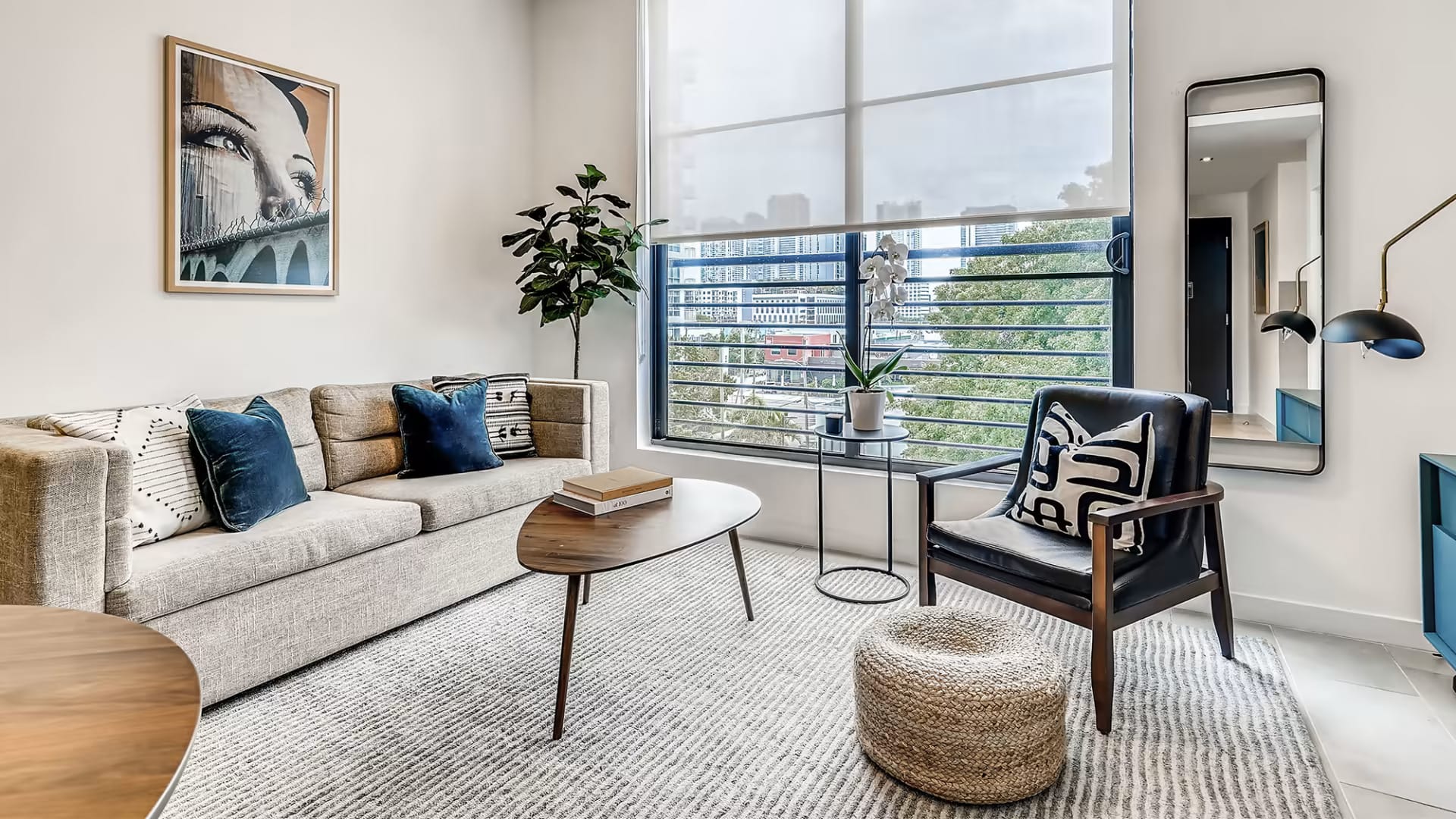 Family-friendly living area at Sentral Wynwood — sofa seating, coffee table, and open-plan design