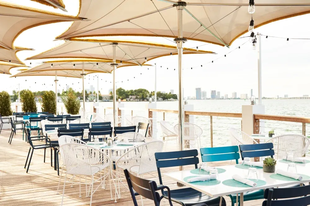 Bayside restaurant at The Standard Spa, Miami Beach with waterfront dock seating overlooking Biscayne Bay