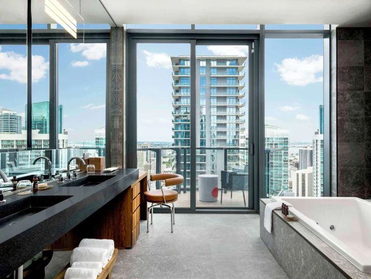Luxury suite at EAST Miami, the best luxury hotel in Brickell for first-time visitors, featuring skyline views, modern design, and a private balcony in downtown Miami.