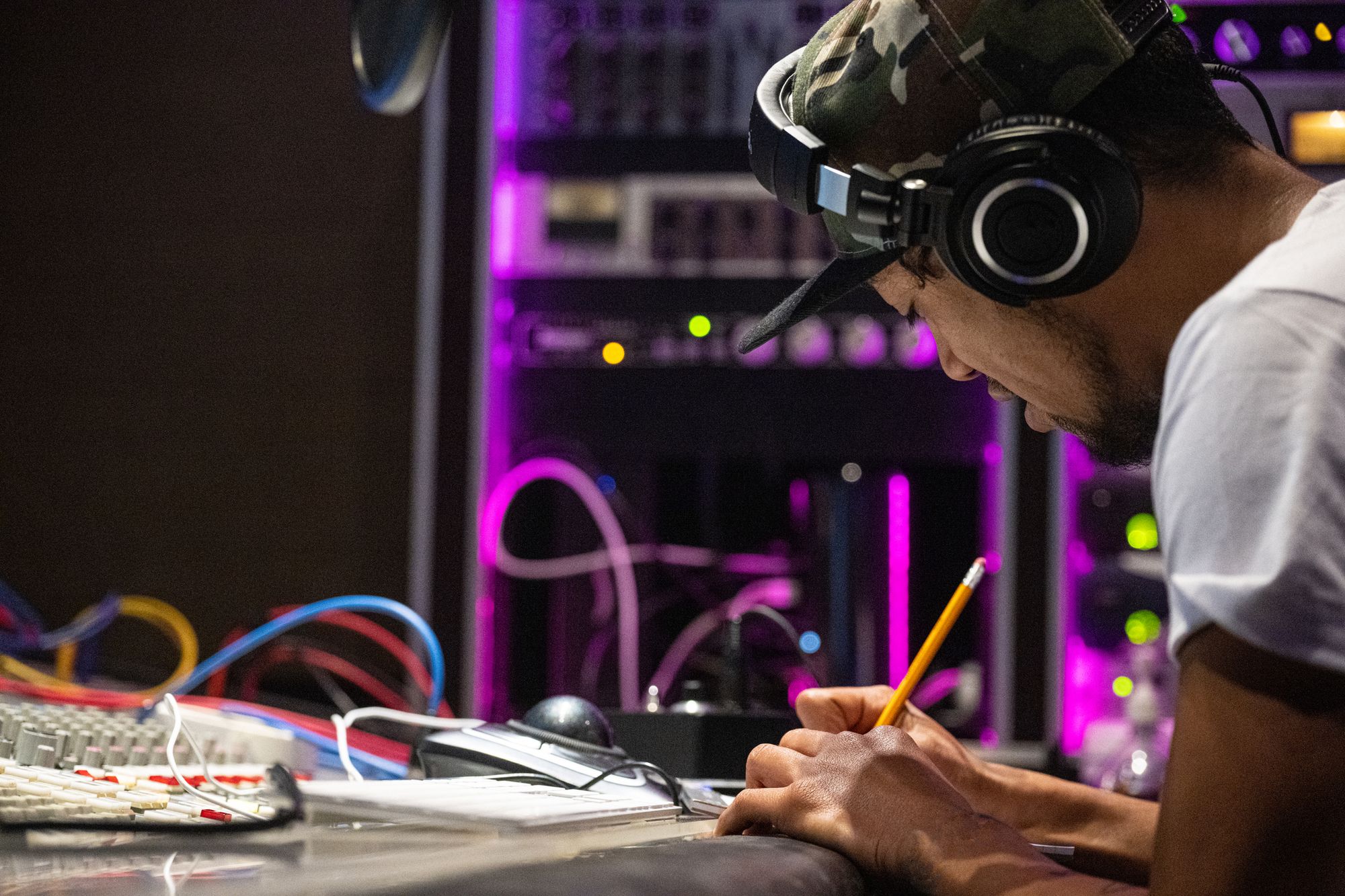 A young New Zealand rapper putting his idea into a song in a recording studio