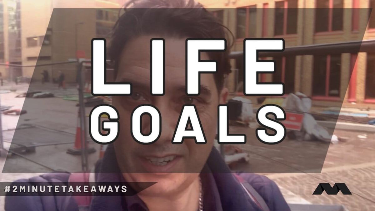 Elliott King films himself beside a building site, a large LIFE GOALS caption across the still.
