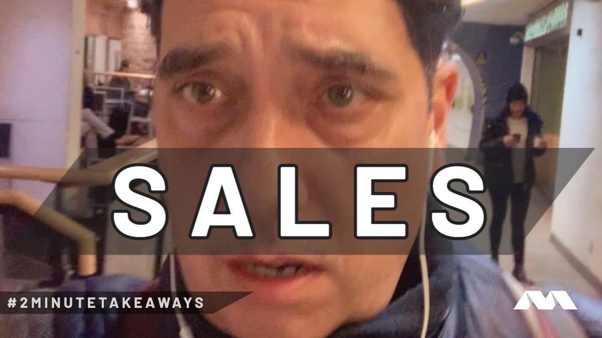 Close-up of Elliott King talking to camera indoors in wired earphones, under a bold SALES caption.