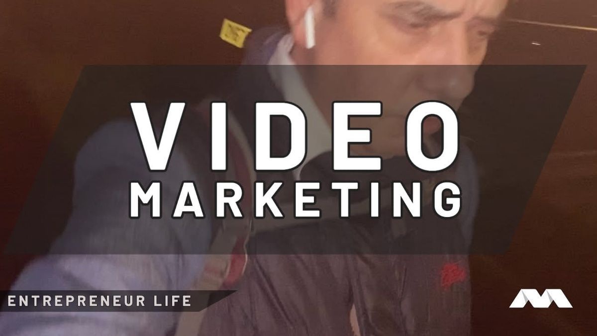 Entrepreneur Life video thumbnail reading Video Marketing over a blurred, dim shot of a man in an AirPod.
