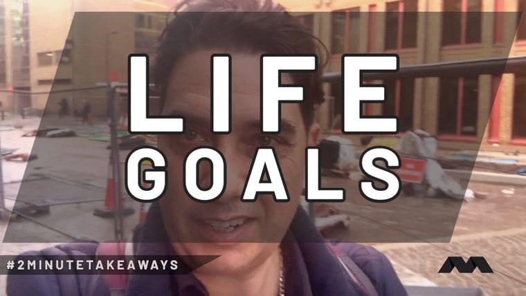 Elliott King films himself beside a building site, a large LIFE GOALS caption across the still.
