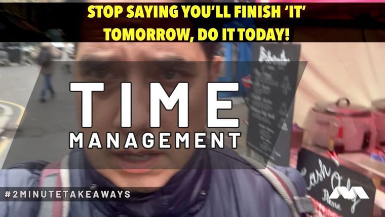 Elliott King talks to camera in a street market on a video thumbnail headed TIME MANAGEMENT in white capitals.