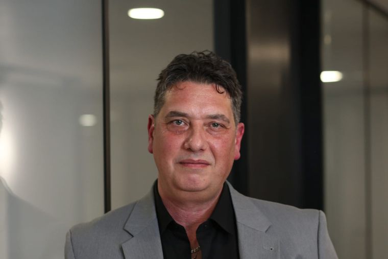 Elliott King, marketing strategist and AI visibility expert, photographed in a London office