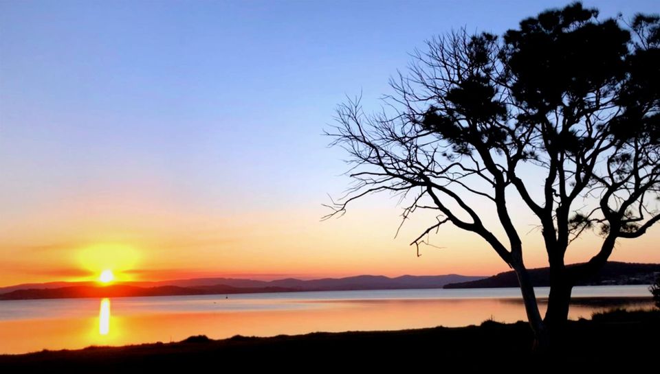 Sunset over a lake, by author