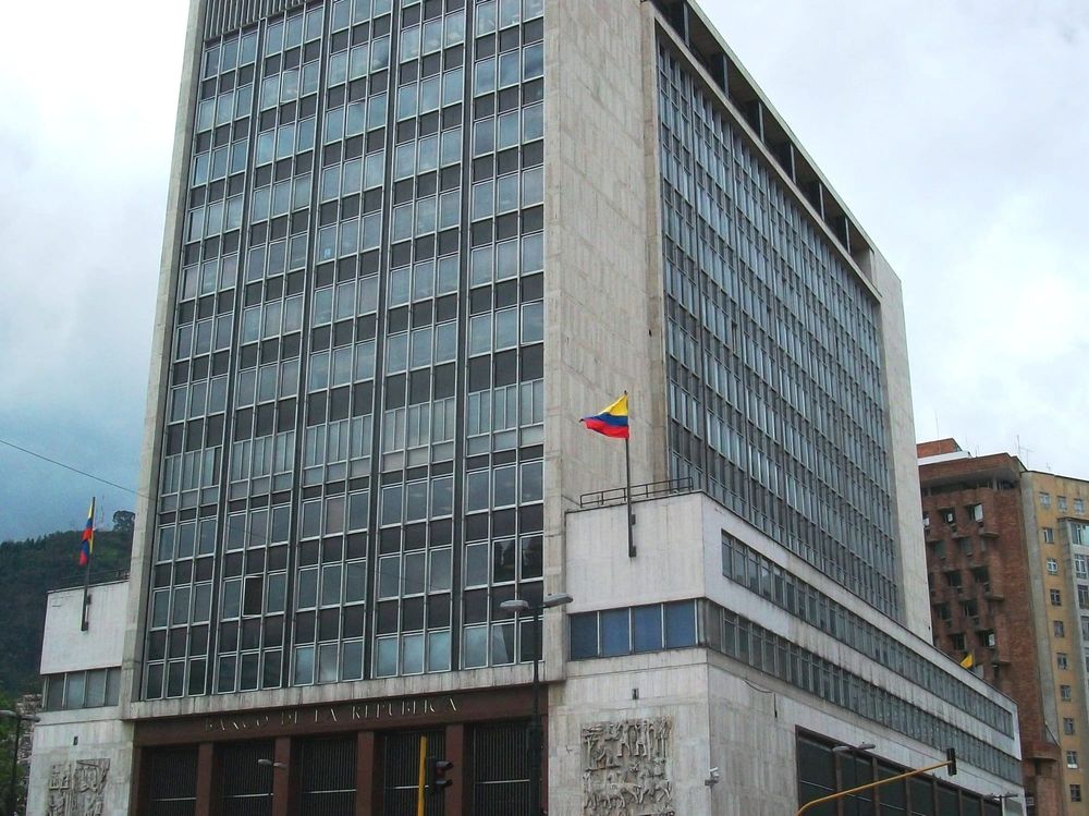 Colombia's central bank holds its rate at 12.25% in a 4-3 vote and approves a $2 billion reserves purchase