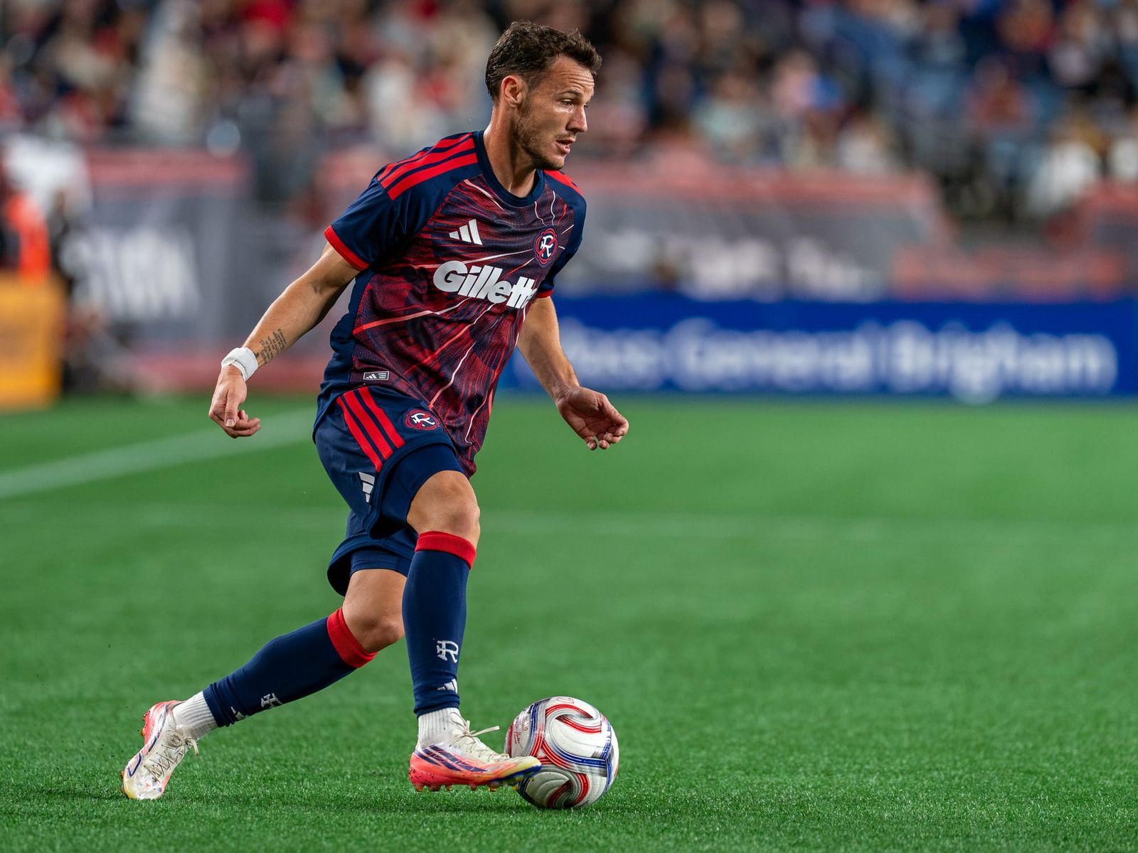 New England Revolution forward Daniel Gazdag dribbles with the ball at Gillette Stadium.
