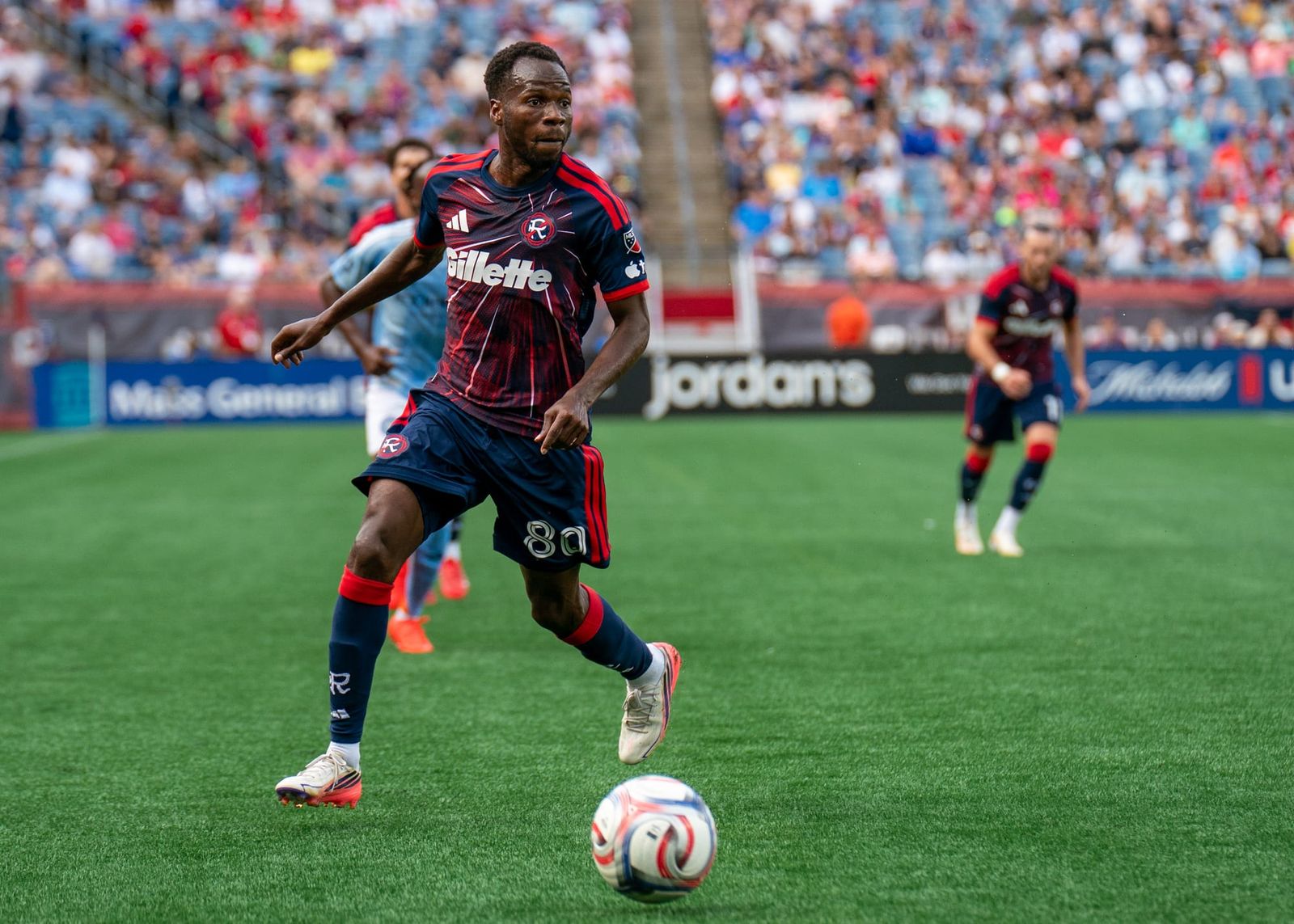 Alhassan Yusuf dribbles with the ball during a match against NYCFC