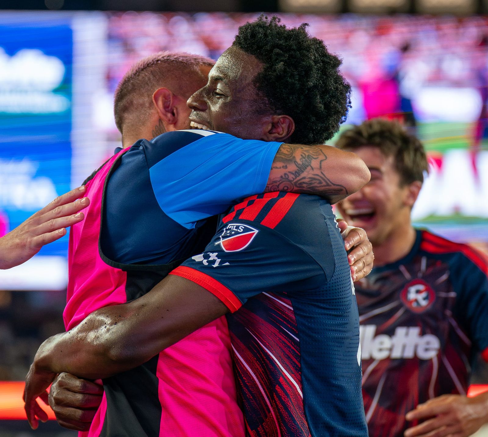 Brooklyn Raines hugs Diego Fagundez after scoring a goal