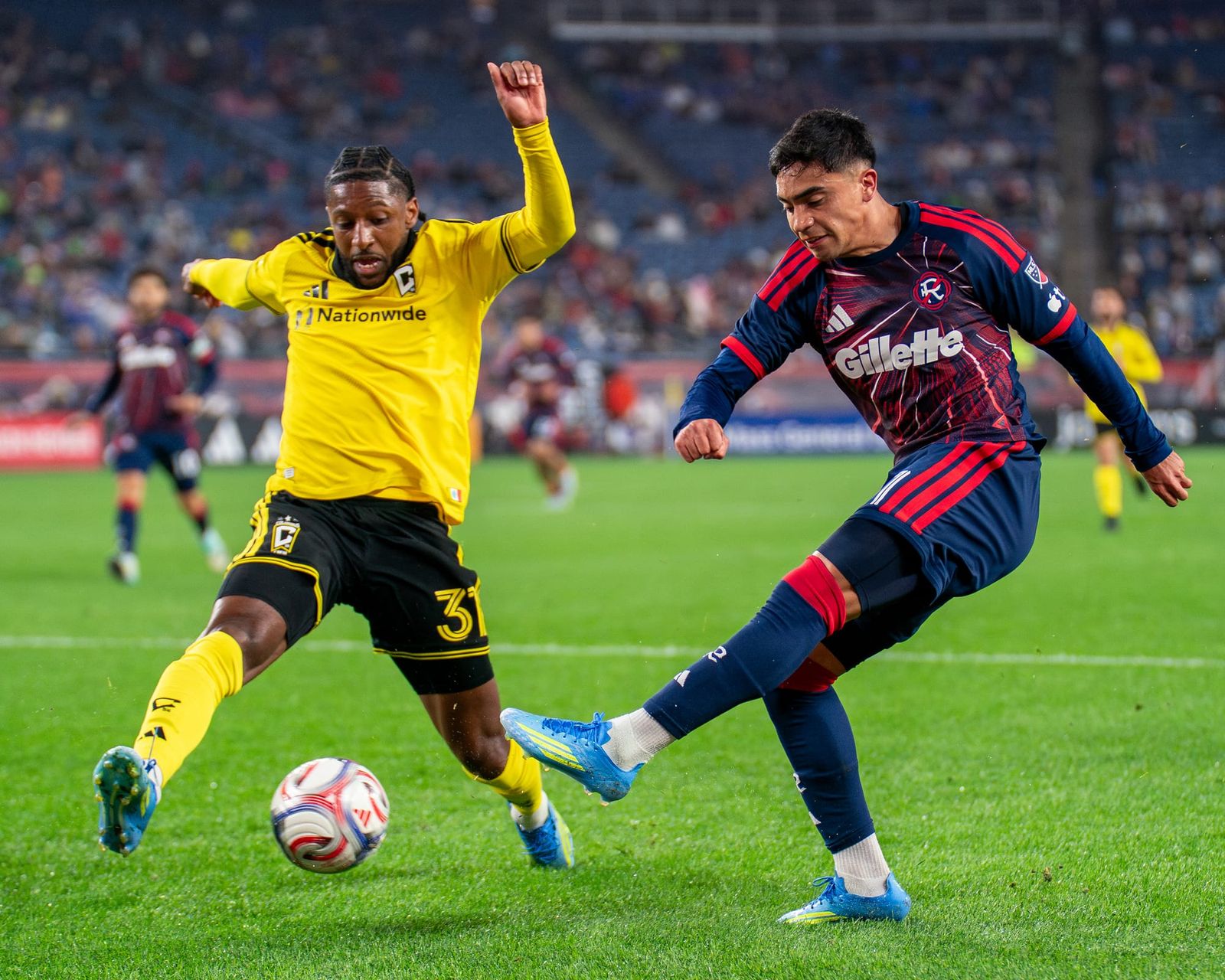 Luca Langoni attempts to pass the ball