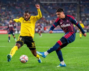 Luca Langoni attempts to pass the ball