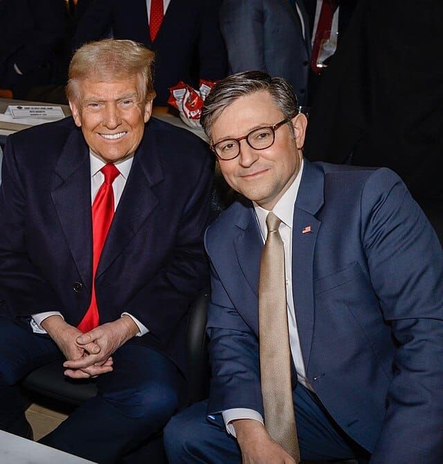 Mike Johnson sitting next to Donald Trump