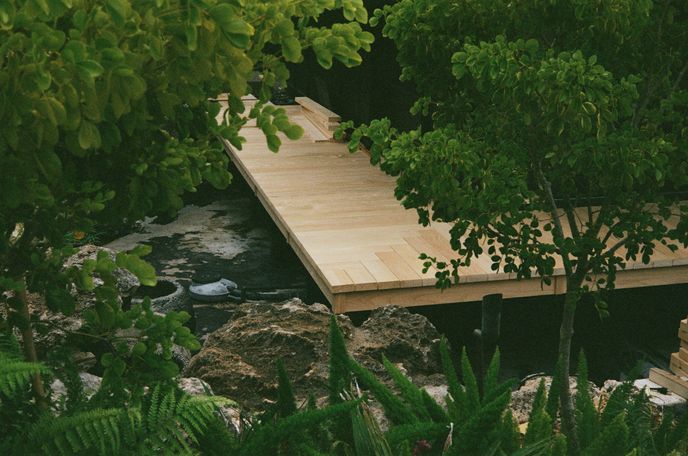 Hand planing a walkway (over a koi pond)