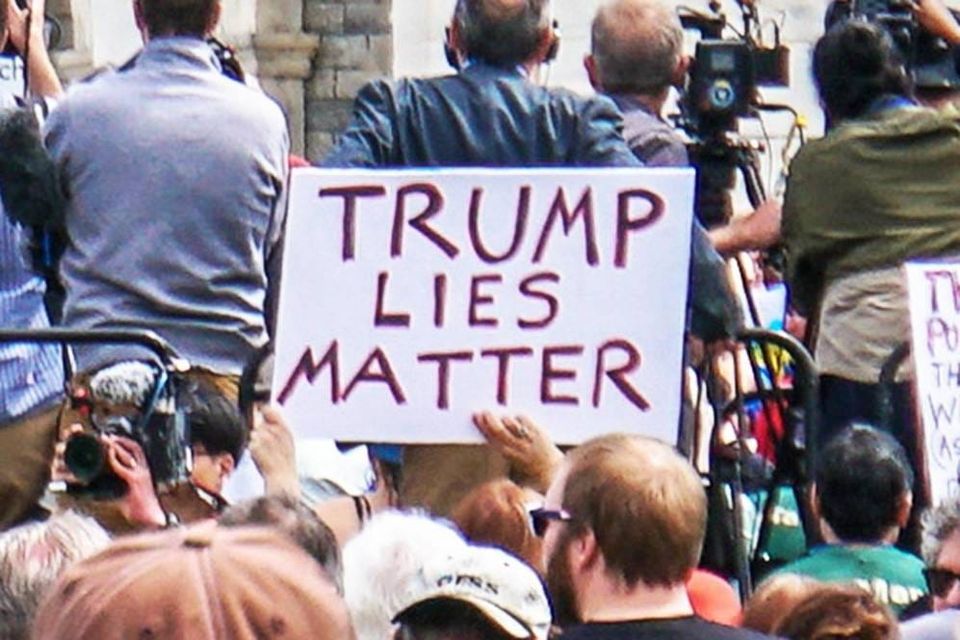 A sign in a crowd that reads "Trump Lies Matter". Photo credit Ted Eytan.