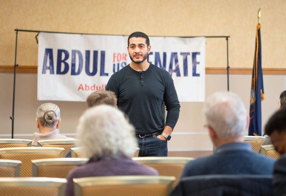 Abdule El-Sayed in front of an Abdul for US Senate banner. 