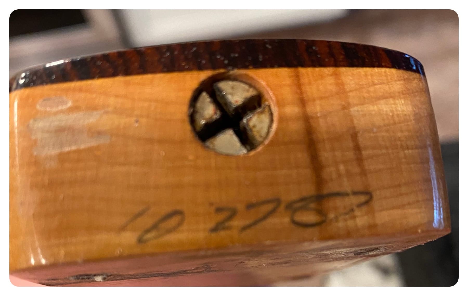 Photo showing Neck heel of the '62 Reissue showing pencil date of 10-27-87