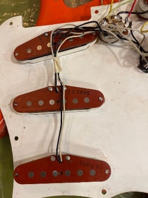 Photo of red-bottom pickups in the '62 Reissue Strat