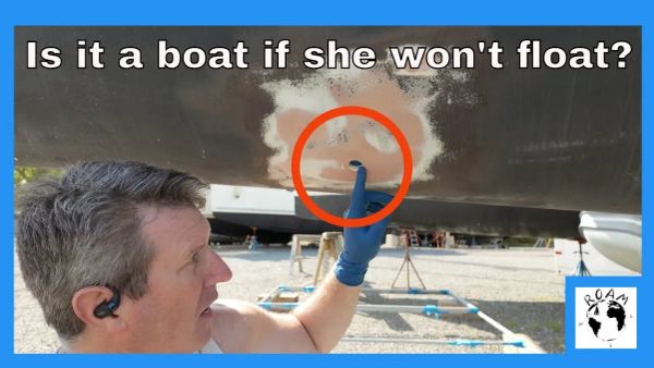 Patching unused thru-hull openings with fiberglass during a sailboat refit.