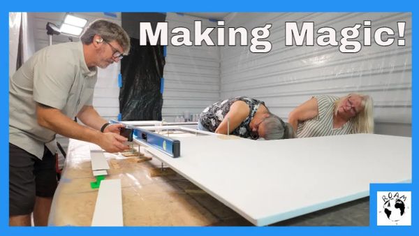 Epoxy resin being poured onto a leveled galley countertop during a sailboat refit.