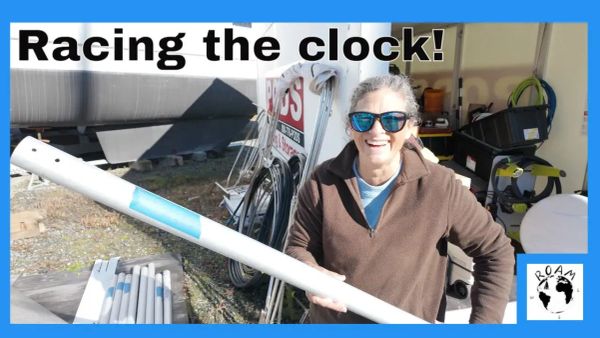 Bare mast laid out for refit work as winter weather complicates preparation for restepping.